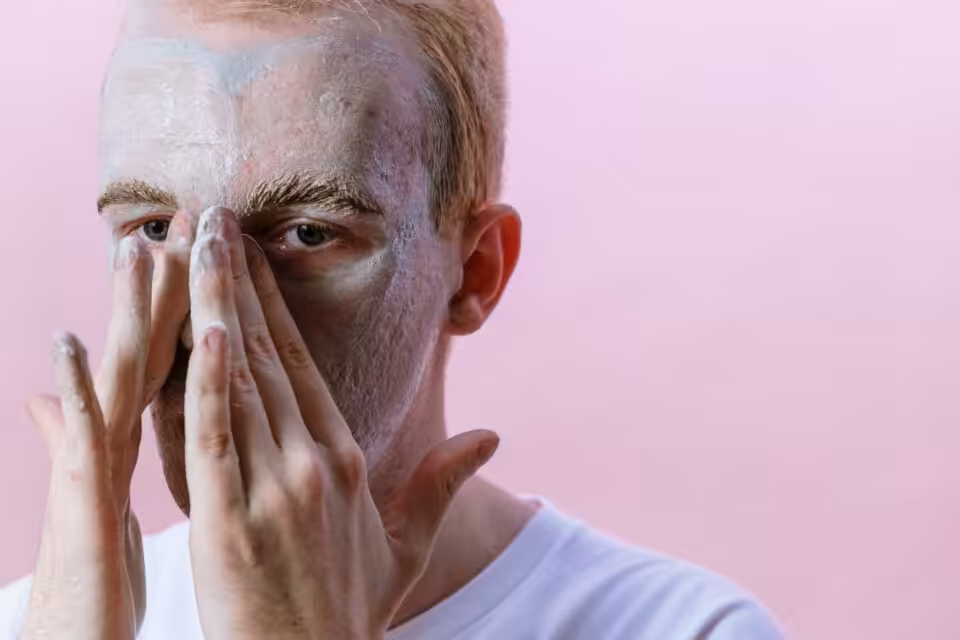 Young man uses a facial peeling